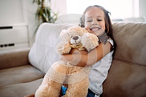 Young girl playing with her favourite toy