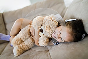 Young girl playing with her favourite toy