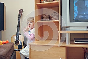 Young Girl Playing Hide-And-Seek At Home photo