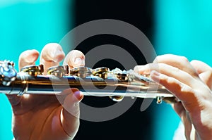 Young girl playing a homemade flute