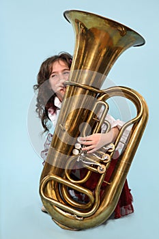 Young girl playing the horn