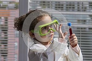 Young girl playing scientist