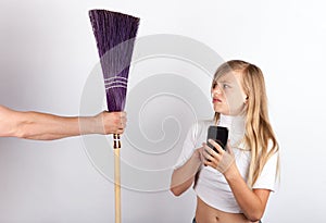 Young girl playing with a smartphone not too impressed by a hand