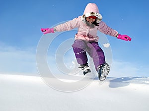 Young Girl Playing in Snow