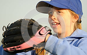 Young girl playing softball