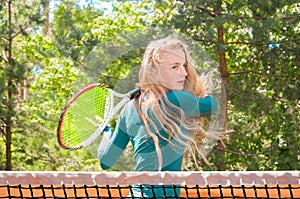 Young girl playing tennis