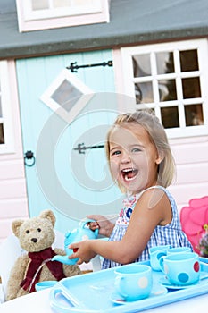 A young girl plays outdoors