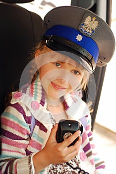 Young girl in police hat