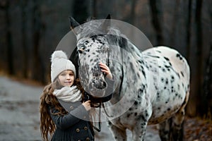 Young girl portrait with Appaloosa horse and Dalmatian dogs