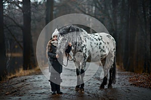 Young girl portrait with Appaloosa horse and Dalmatian dogs