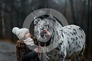 Young girl portrait with Appaloosa horse and Dalmatian dogs