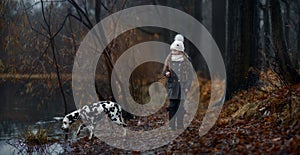 Young girl portrait with her Dalmatian dogs