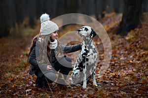 Young girl portrait with her Dalmatian dogs