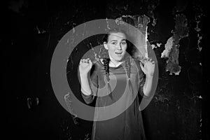 Young girl portrait in an old house with burnt walls