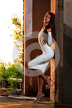 Young girl posing in an abandoned building