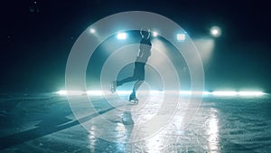 Young girl is posing gracefully during figure skating