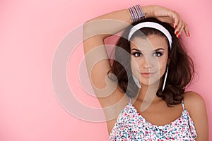 Young girl posing over pink wall