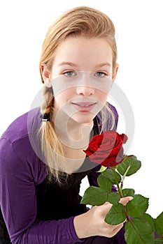 Young girl posing with red rose