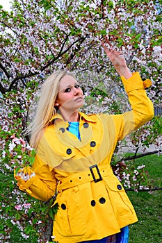 Young girl posing in the sakura garden