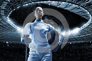 Young girl posing on a stadium background. The concept of fencing