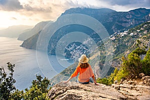 Young girl on Positano coast background, Amalfi, Italy