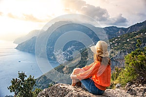 Young girl on Positano coast background, Amalfi, Italy