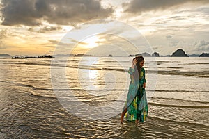 Young girl posses at Ao Nang Beach, Krabi, Thailand