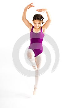 Young girl practicing her ballet.