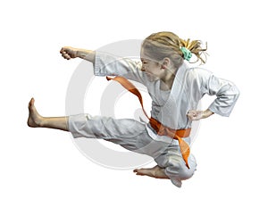 Young girl practicing karate kick