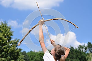 Young girl practising archery