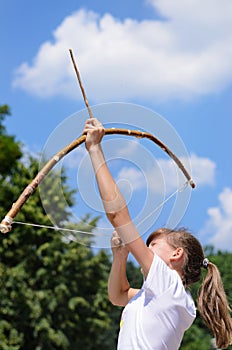 Young girl practising archery