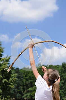 Young girl practising archery