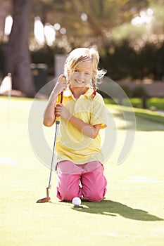 Young Girl Practising Golf