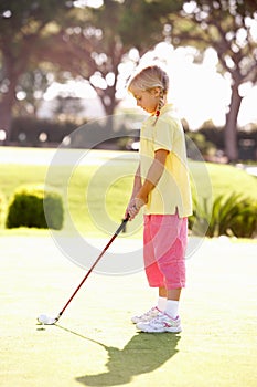 Young Girl Practising Golf