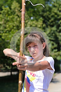 Young girl practising her archery