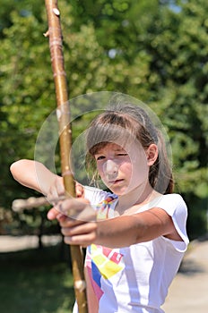 Young girl practising her archery