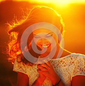 A young girl prays photo