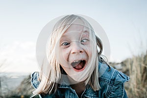 Young girl pulling a funny face