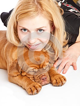 Young girl with puppy of Dogue de Bordeaux