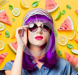 Young girl with purple hair and sunglasses