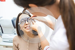 Young girl puts on contact lenses