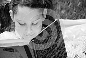 Young girl reading book