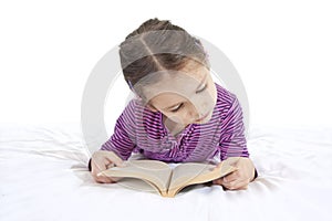 Young girl reading book isolated