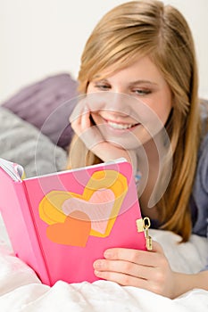 Young girl reading her journal of memories