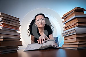 Young girl reading very interesting book at home