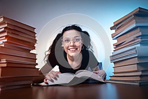 Young girl reading very interesting book at home