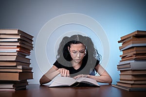 Young girl reading very interesting book at home