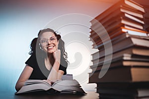 Young girl reading very interesting book at home