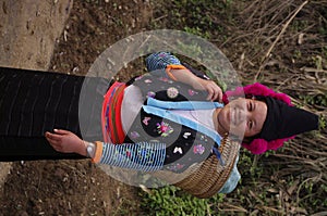 Young girl red pompons Hmong