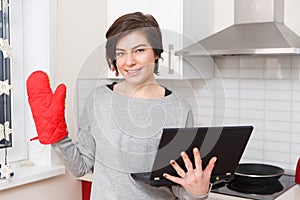 Young girl with red potholder